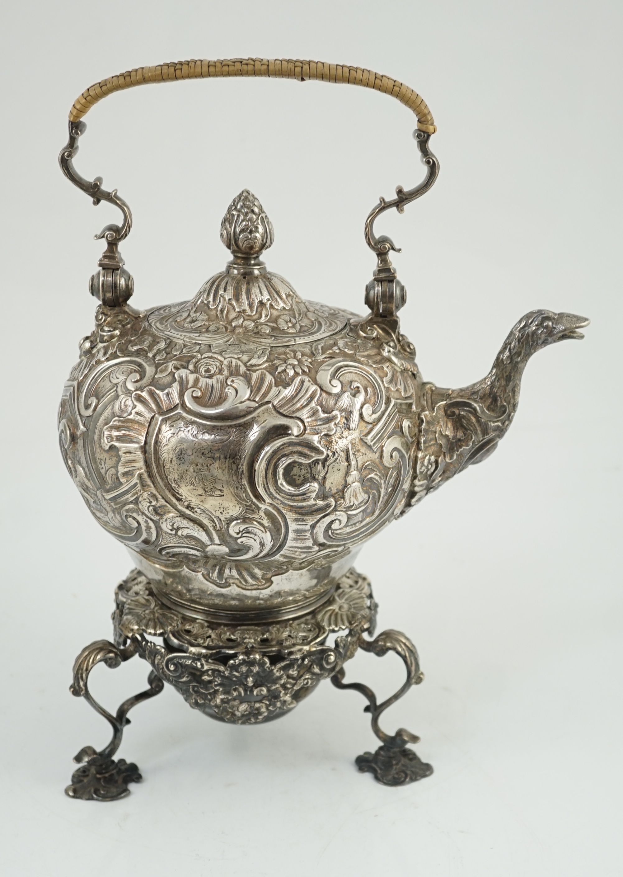 A George II embossed silver tea kettle on stand, with burner, by Francis Crump